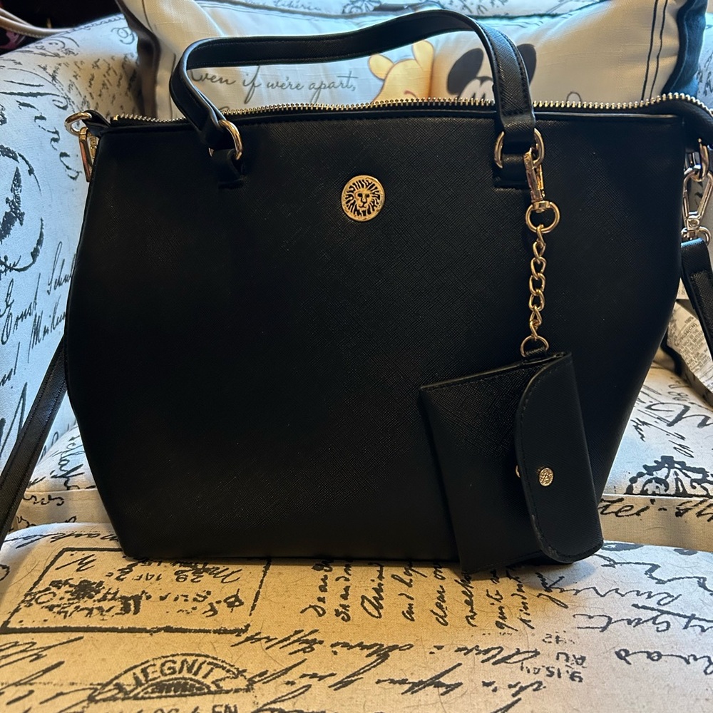 Anne Klein Black and Gold Satchel with Elegant Charm